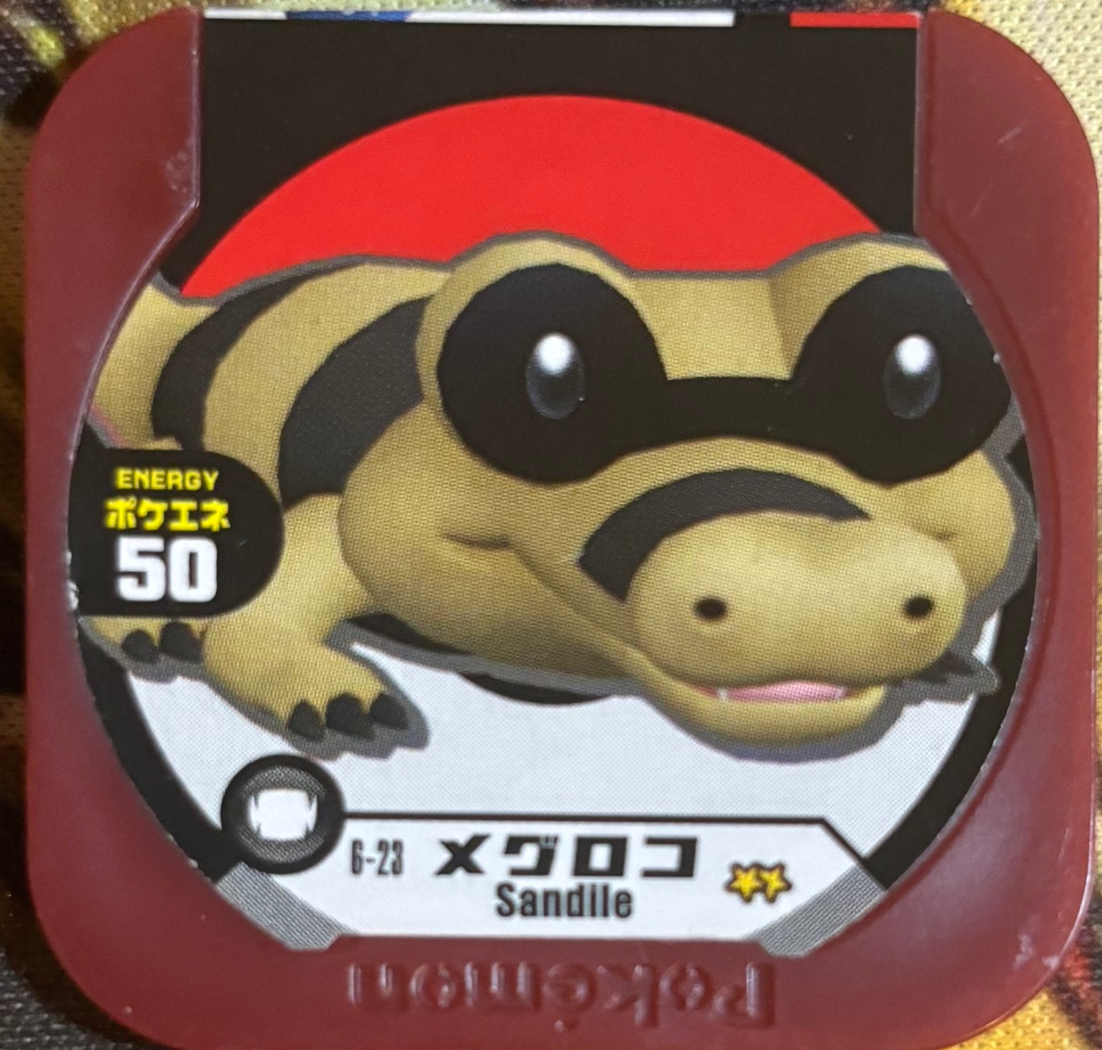 Sandile collectible #6-23, Pokemon Tretta Fes Wave 1 Checklist, front