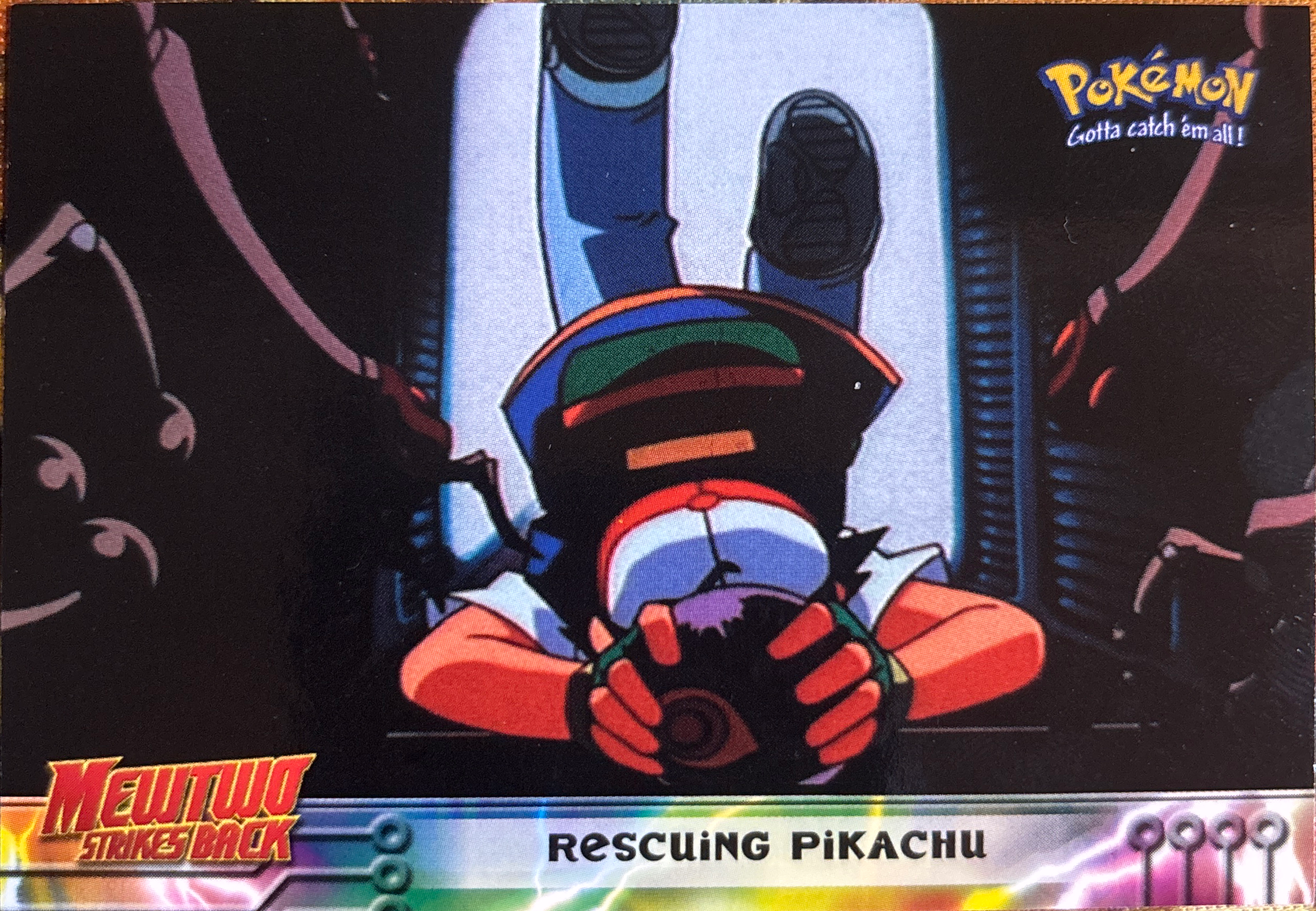 Rescuing Pikachu card #30, Pokemon Topps First Movie Trading Cards (1999), front