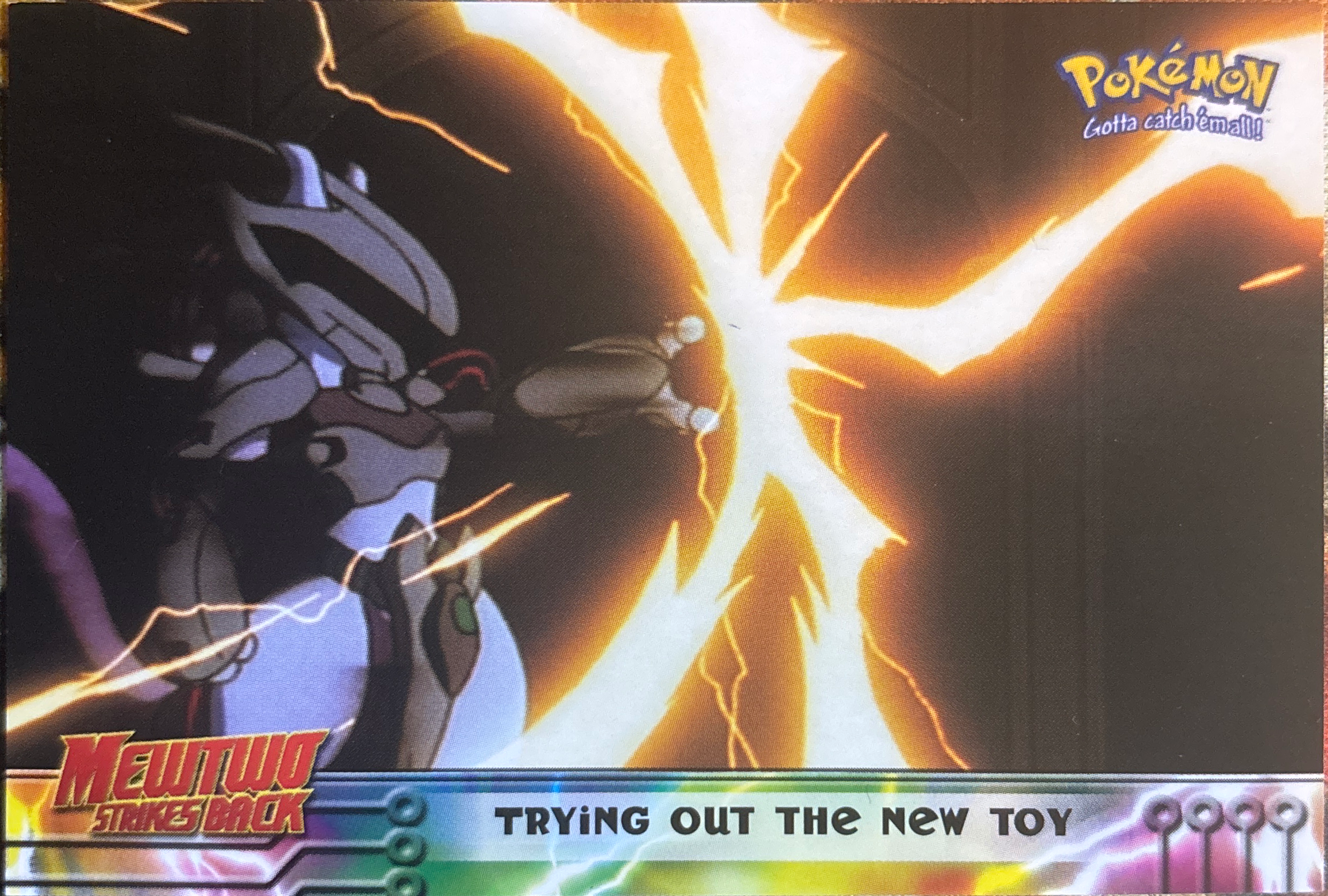Trying Out the New Toy card #7, Pokemon Topps First Movie Trading Cards (1999), front