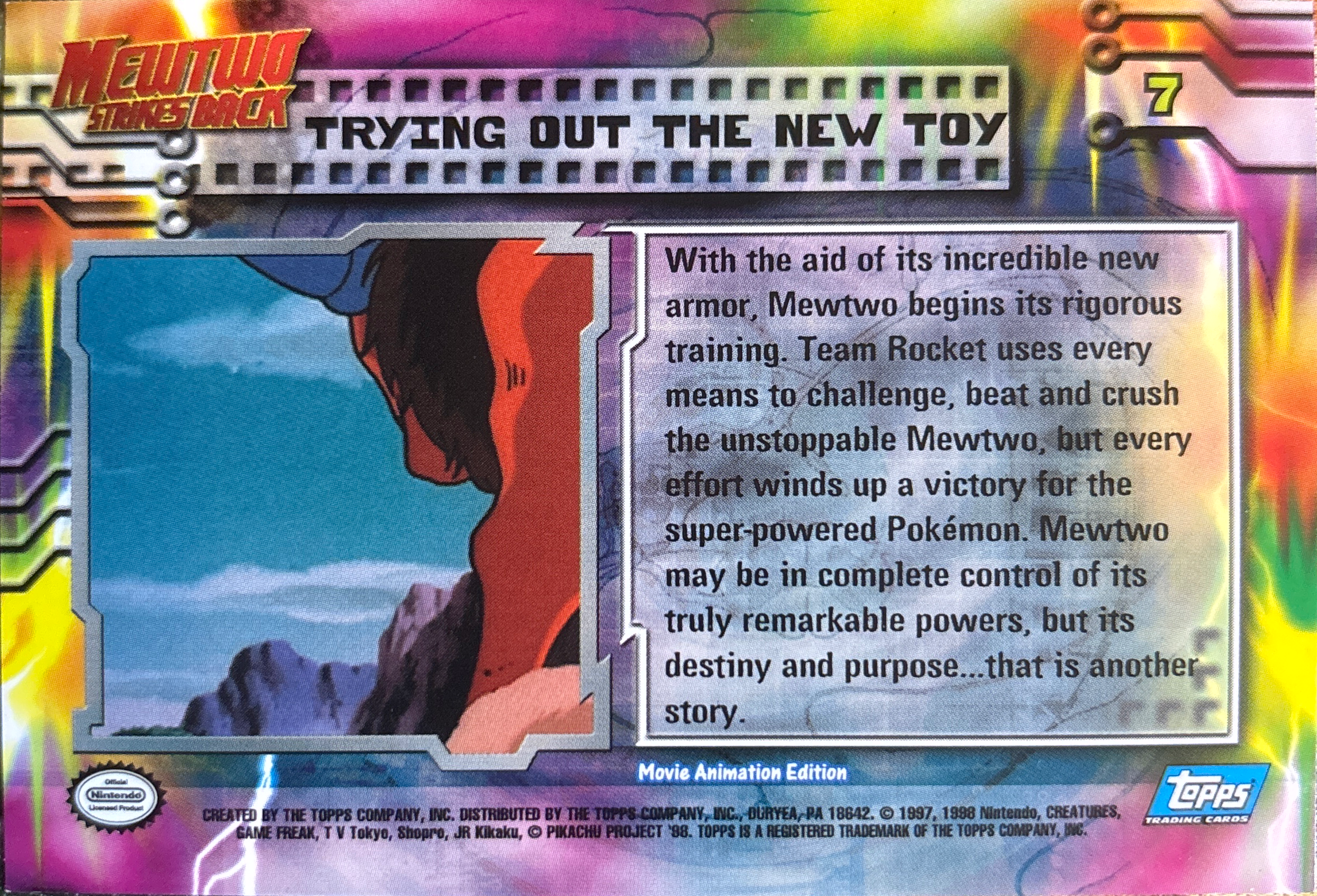 Trying Out the New Toy card #7, Pokemon Topps First Movie Trading Cards (1999), back