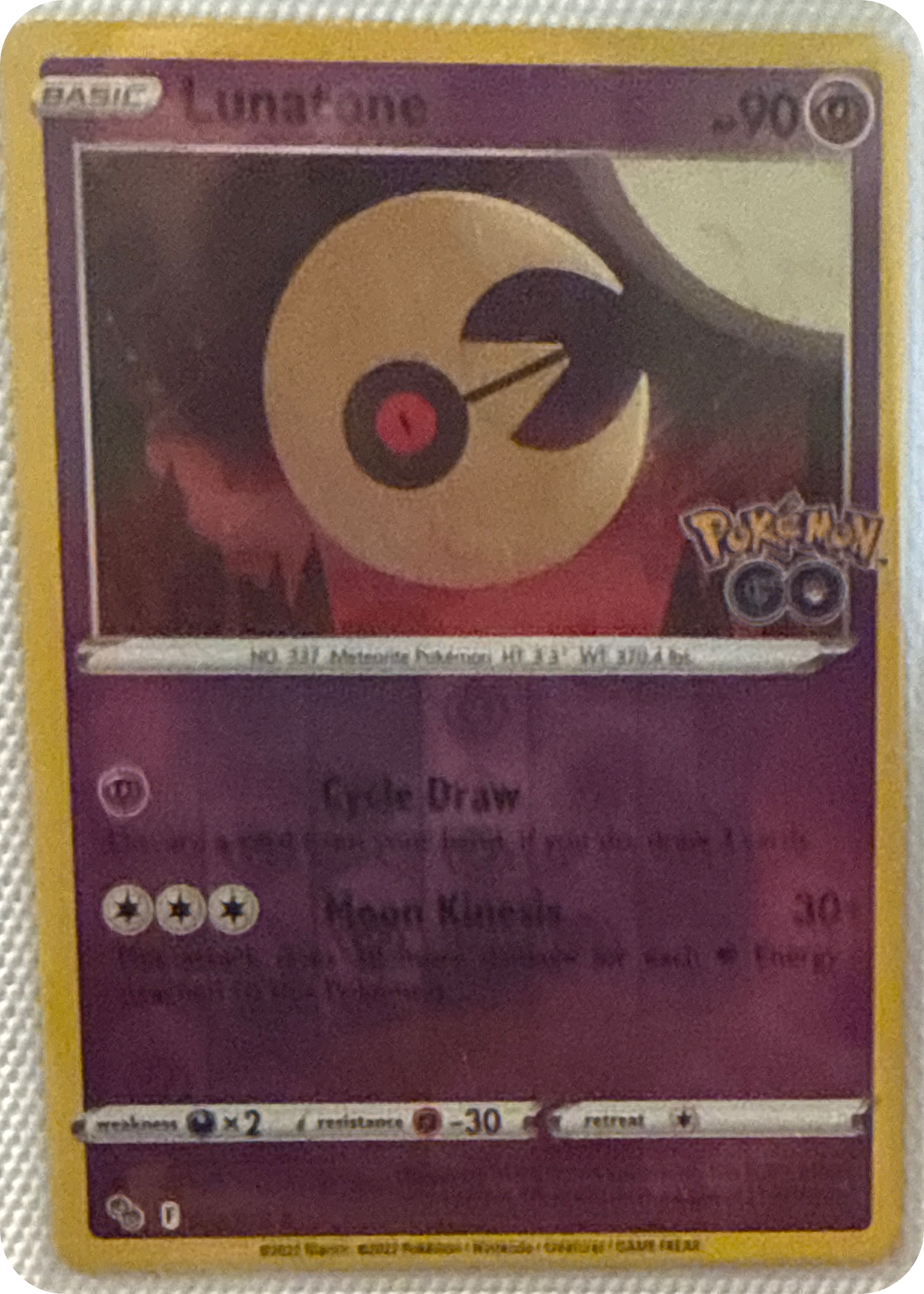 Lunatone trading card #34, Pokémon GO (2022), front