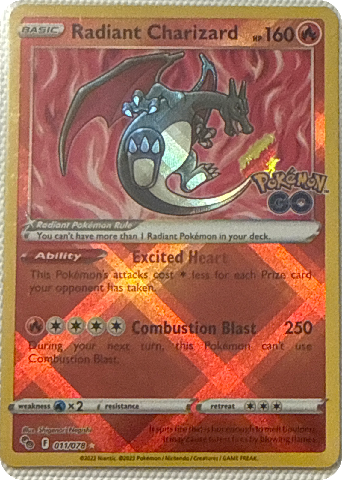 Radiant Charizard trading card #11, Pokémon GO (2022), front