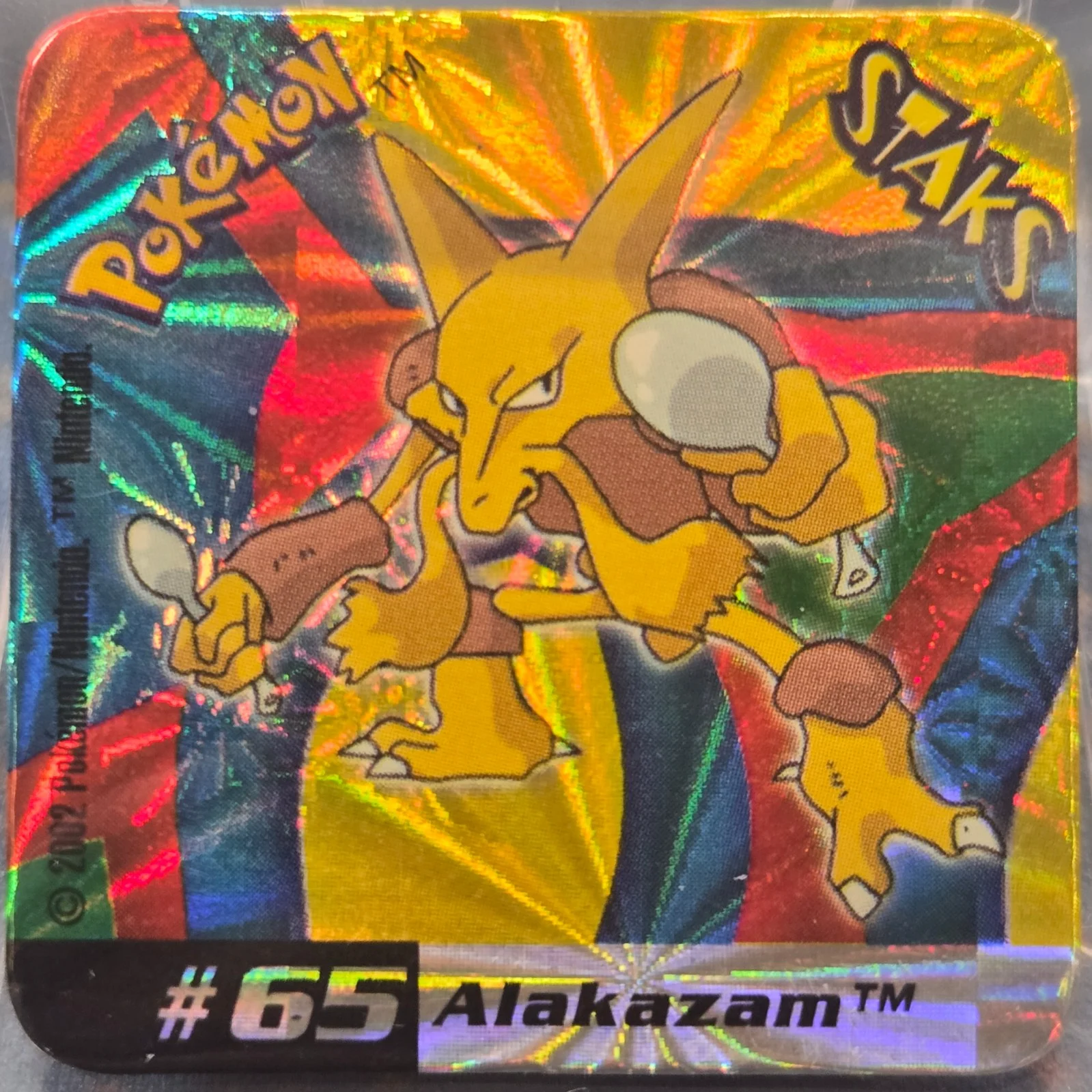 Alakazam collectible #065, Pokémon Staks Johto League Champions (2002), front